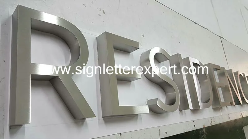 Brushed stainless steel lettering signs