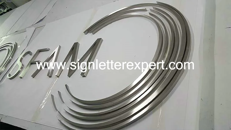 Brushed stainless steel logo signs