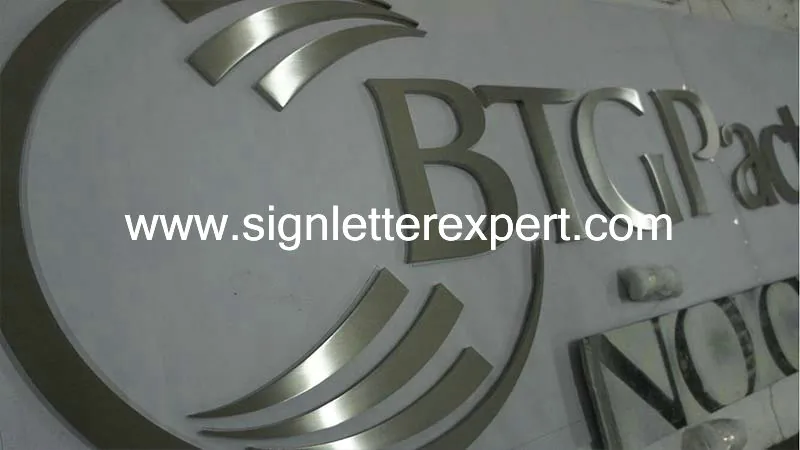 Brushed stainless steel logo signs