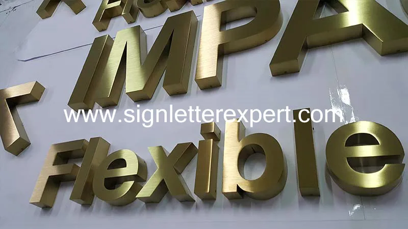Golden brushed stainless steel letter signage