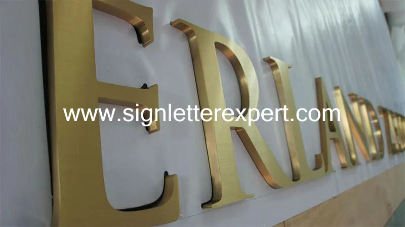 Golden brushed stainless steel letter signage