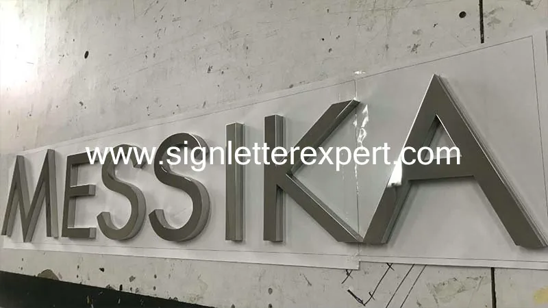 Polished chromed stainless steel signage