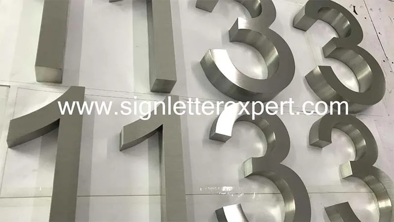 Brushed stainless steel sign numbers