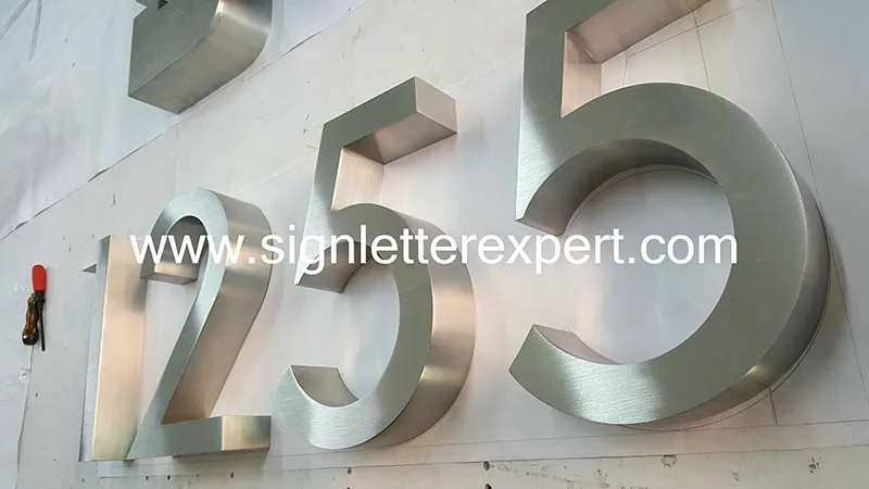 Brushed stainless steel sign numbers