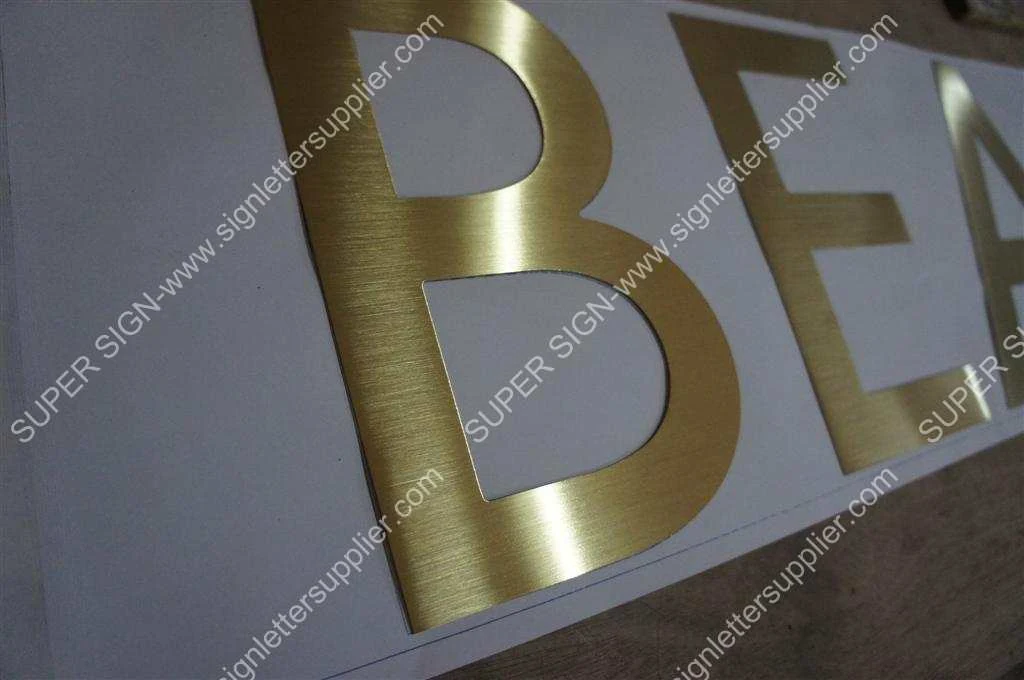 golden color brushed stainless steel sign letter