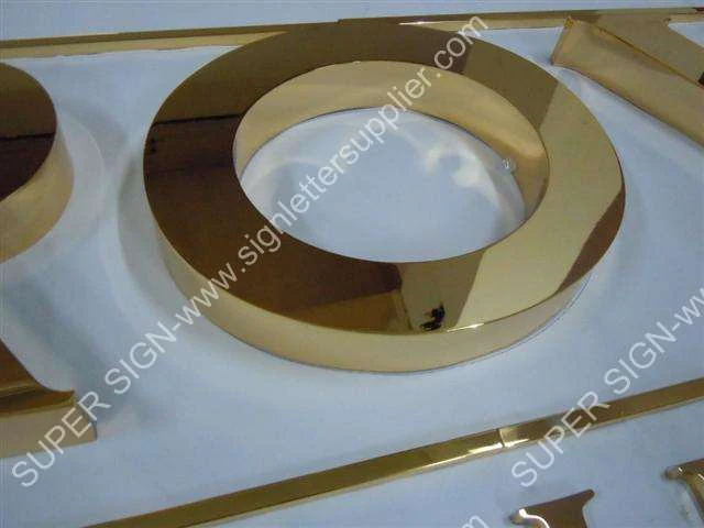golden polished steel letter 03 — additional workshop photograph of the finished letter