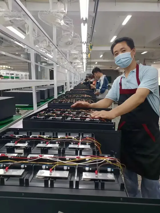Workers assembling lithium battery packs on the Sike Power production line