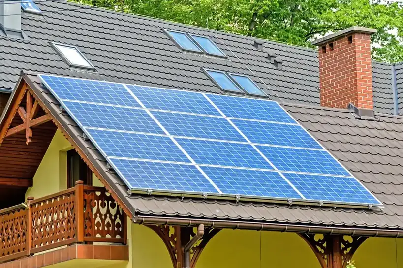 Home with rooftop solar panels powered by residential lithium battery storage