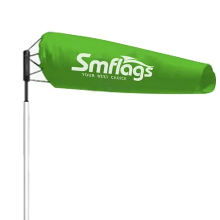 Windsock flag mounted on a vertical pole at an airport or highway location