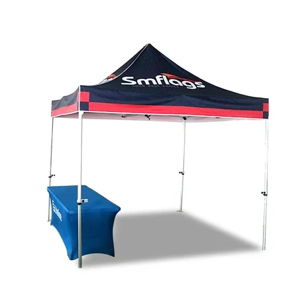 Tent with full wall and ground spikes secured in grass at an outdoor event