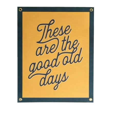 Felt banner with custom shape and felt border, displayed on a stand
