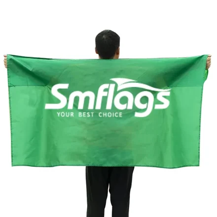 Row of body flags in different colours and designs, worn by a group at a parade