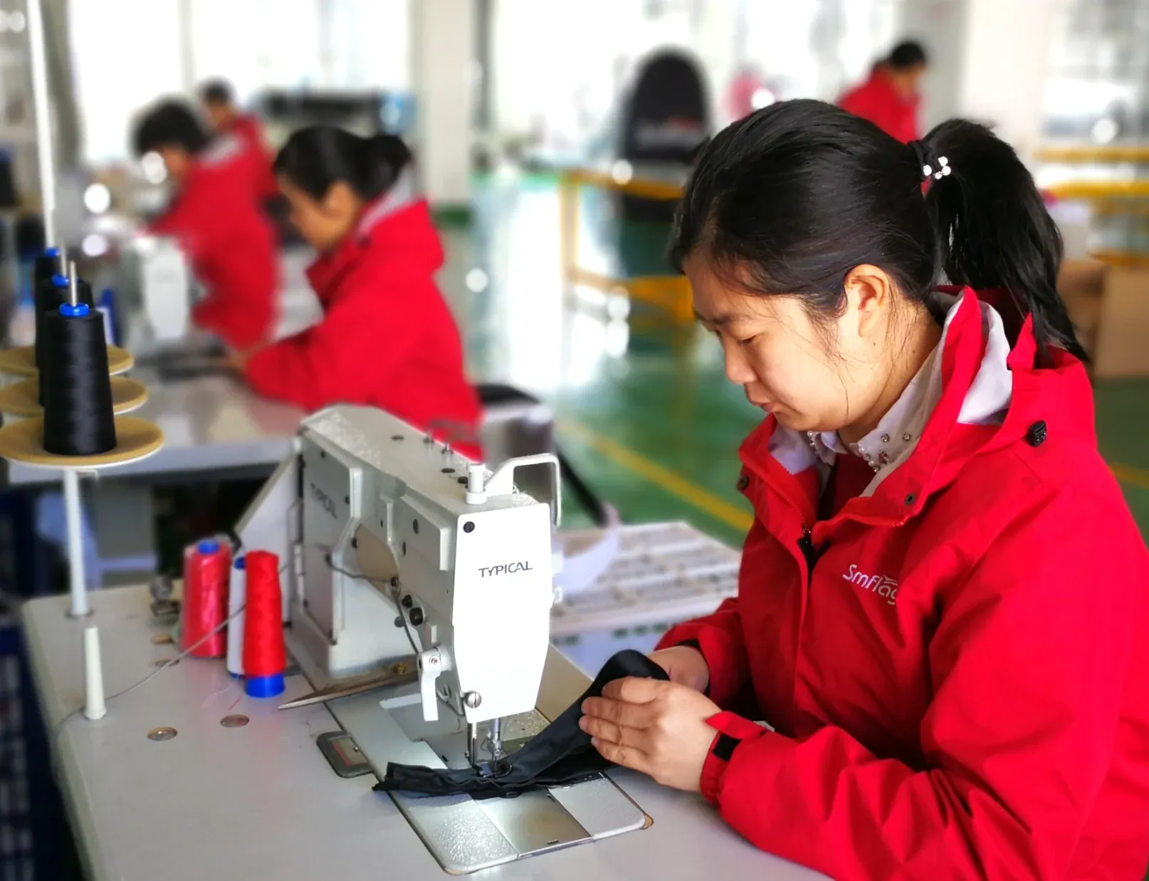 Sewing line at the Siming Displays factory stitching printed polyester flags