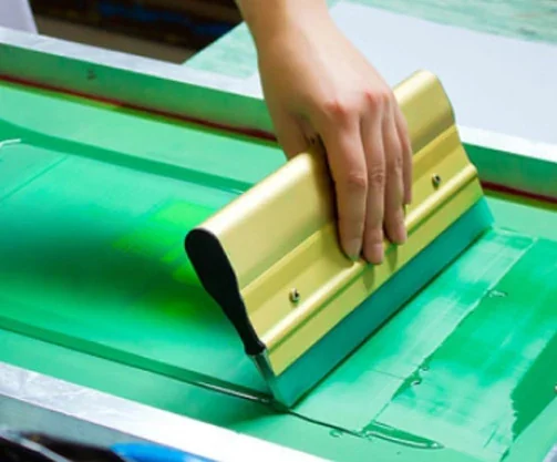 Silk screen printing, available where the run and the artwork suit it.