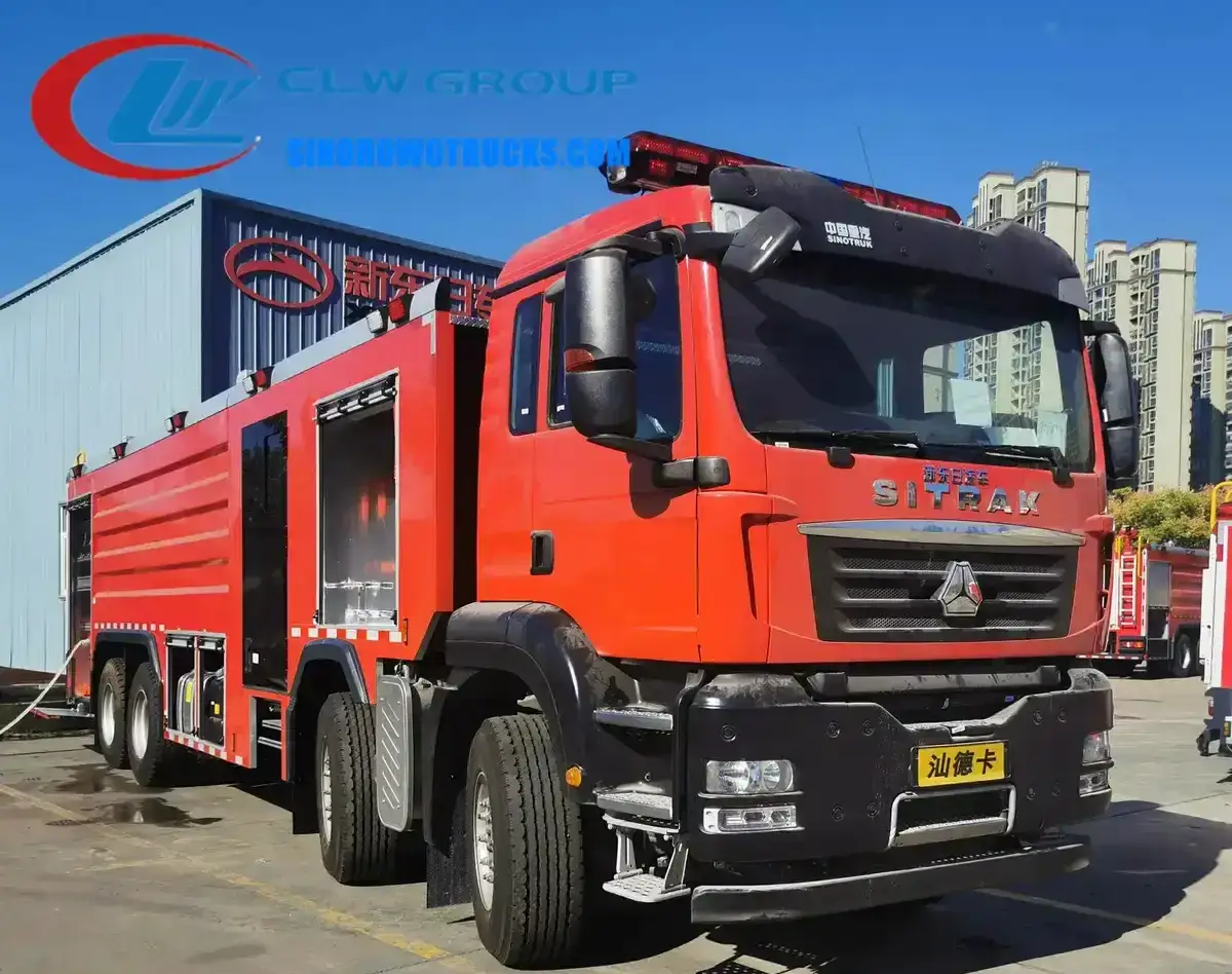 Sinotruk SITRAK 12 wheel fire fighting truck in fire service red with roof mounted monitor and hose lockers