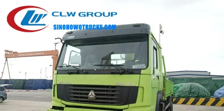 4WD Sinotruk HOWO Forest off-road container crane truck with SQ8SK3Q crane in operation on rough terrain
