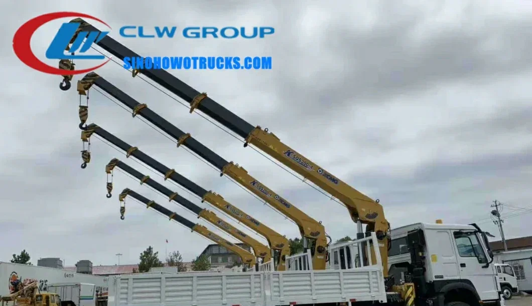 6 wheel Sinotruk HOWO 8 tons boom truck crane in construction site environment with crane extended and load suspended