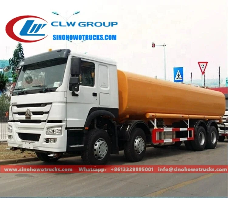 8x4 Sinotruk HOWO 30000 litre water sprinkler truck in red with front, rear and side spray nozzles and high cannon