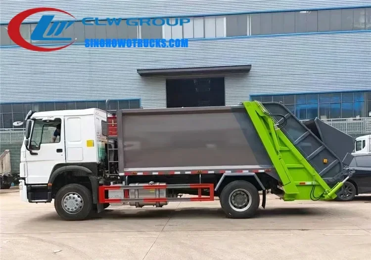 Sinotruk HOWO 14cbm compact bin truck in urban waste collection service with rear loading gate open