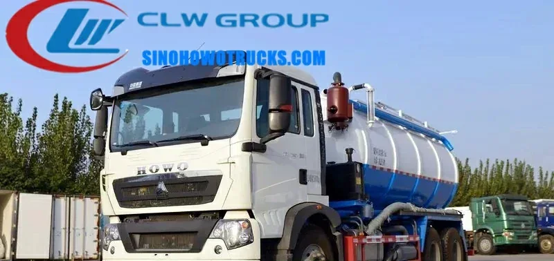 HOWO 18tons vacuum tank truck Chad in service with hydraulic tailgate open and suction hose extended