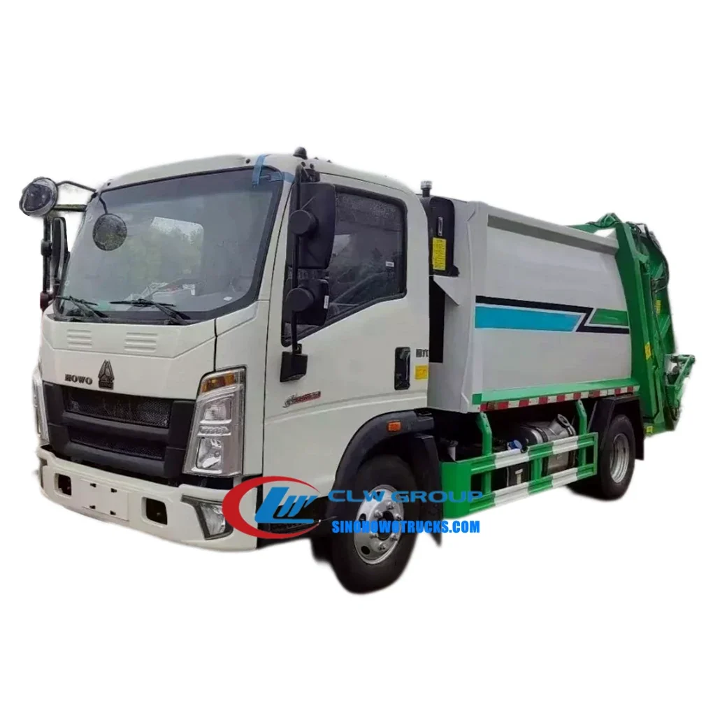 HOWO 6cbm refuse compactor truck in urban waste collection service with rear loading hopper open