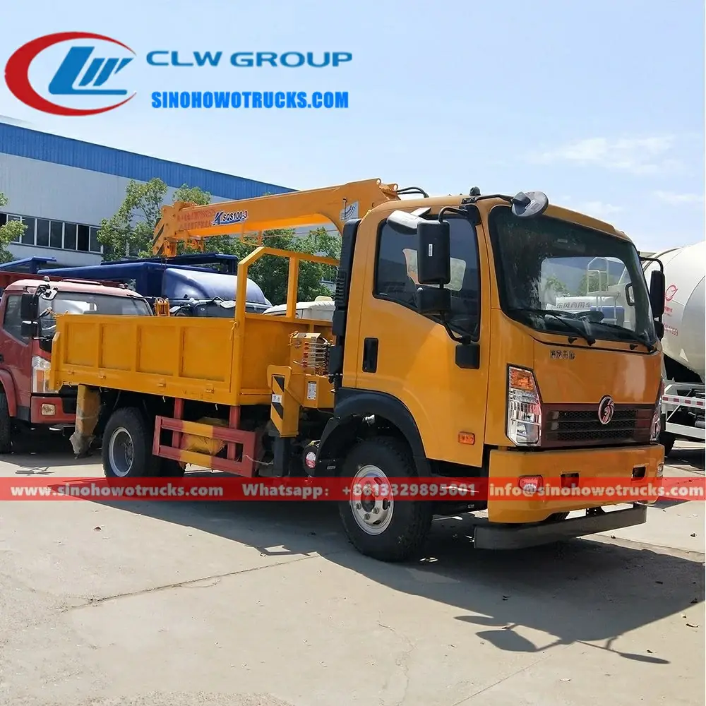 Sinotruk 4 ton truck loader crane in Cambodia with telescopic boom extended and crane in operation