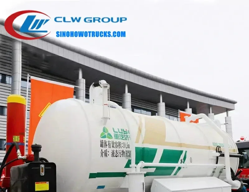 Sinotruk HOWO 12000 litre sludge truck in Djibouti with cylindrical tank and front-mounted vacuum pump