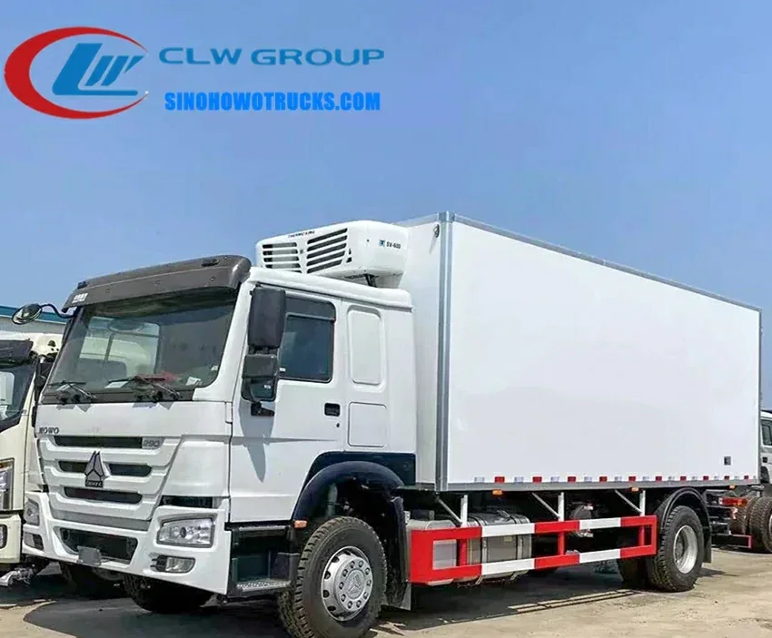 Sinotruk HOWO 15 ton refrigerated box truck in white with side doors open, showing insulated interior