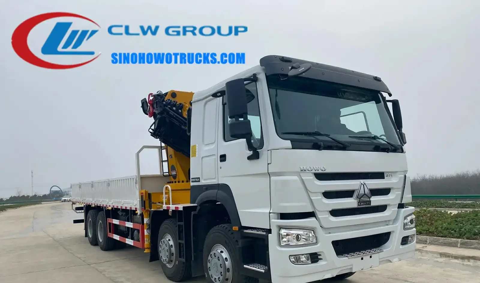 Sinotruk HOWO 16t knuckle boom crane truck in service in Guinea Bissau with crane extended and boom at full reach