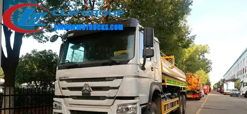 Sinotruk HOWO 6x4 septic vacuum truck in white with 18,000 litre tank and front-mounted vacuum pump