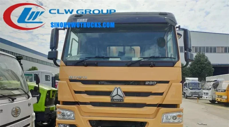 Sinotruk HOWO 6x4 bitumen chip sealer truck with integrated spray and spread system in standard road maintenance livery
