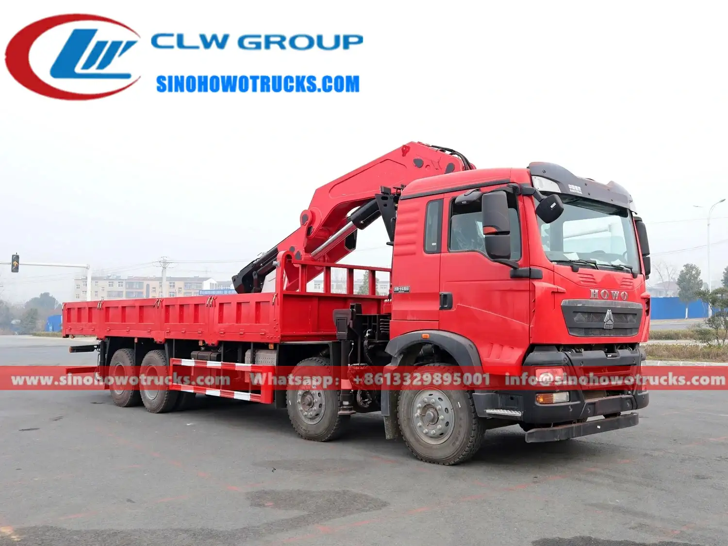 Sinotruk HOWO 6x4 truck mounted knuckle boom crane in industrial grey with crane arm extended