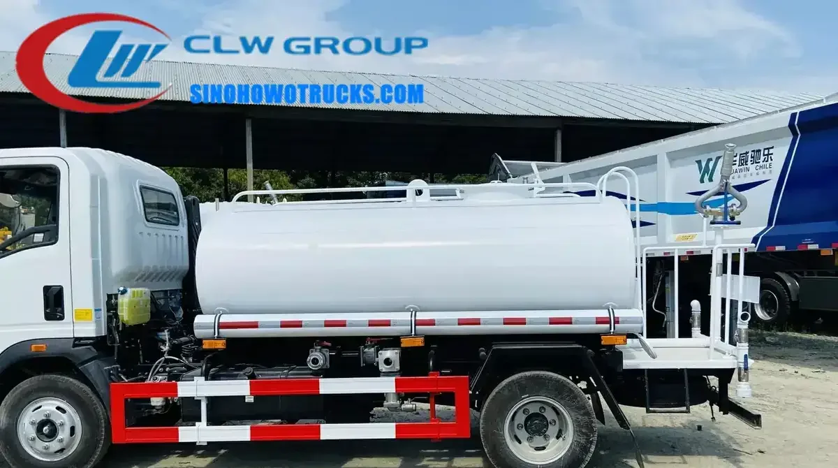 Sinotruk HOWO 4x2 mini water truck in white with front flush and rear spray nozzles in operation