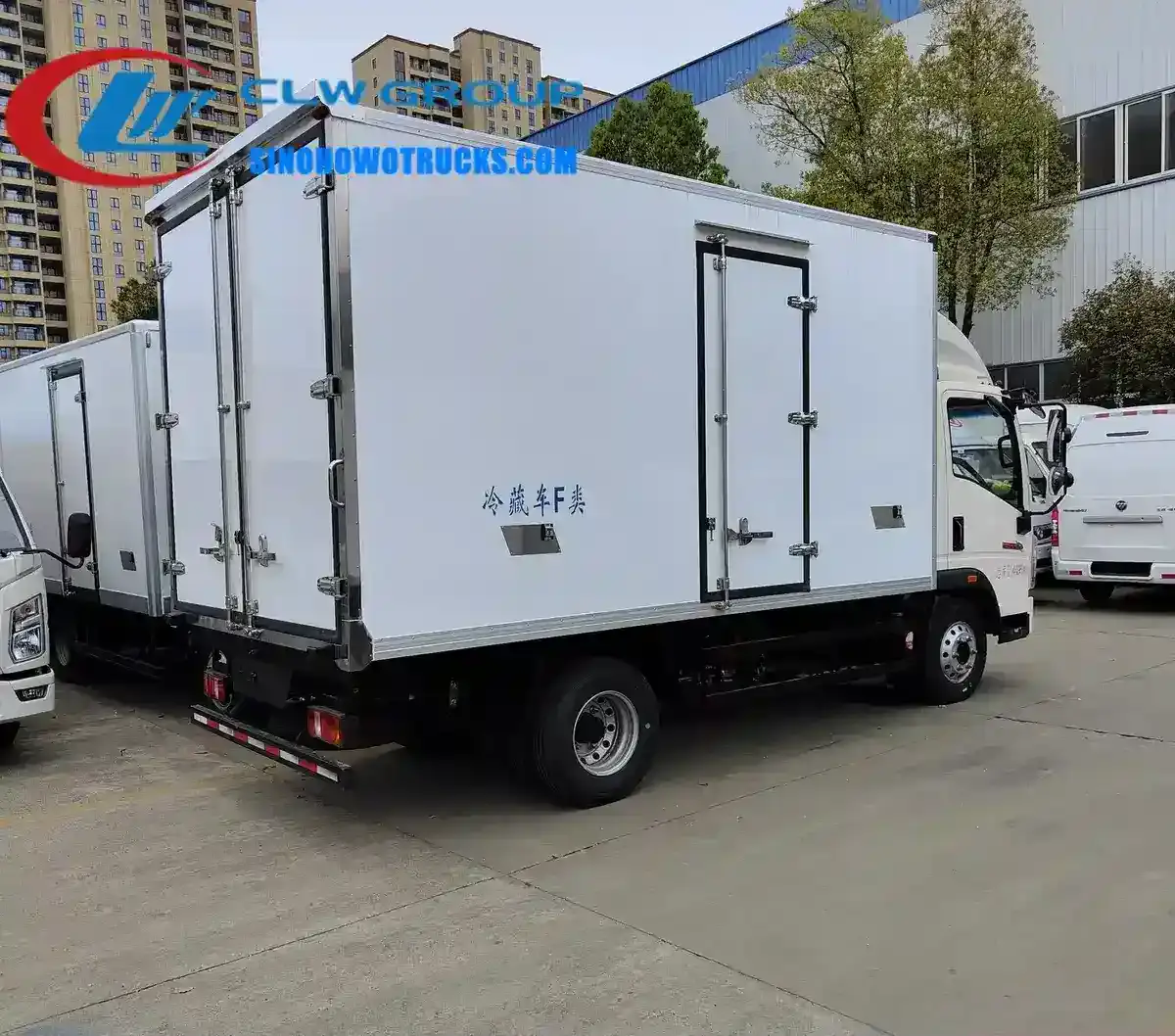 Sinotruk HOWO 5 ton refrigerated van in white with side door open, showing internal FRP lining and refrigeration unit