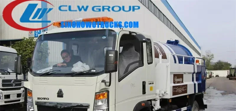 Sinotruk HOWO 5000L sewer jetter truck in standard grey with high-pressure hoses and vacuum tank visible