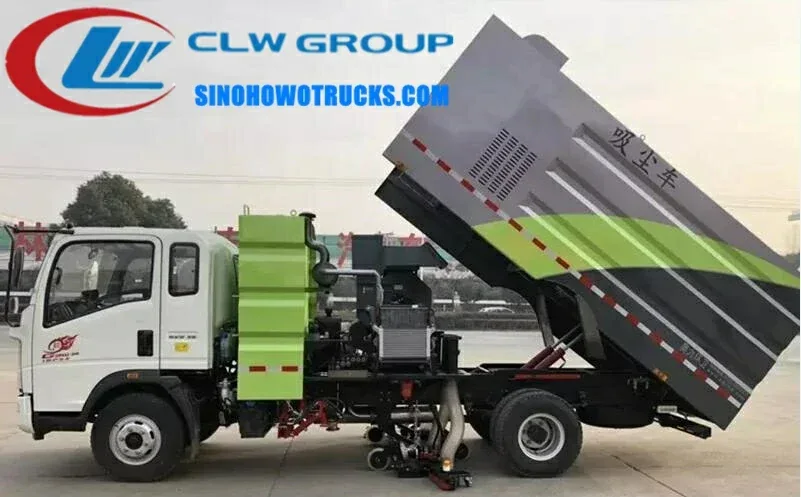 Sinotruk HOWO 5m3 road sweeper lorry in urban street cleaning operation with front brush and water spray