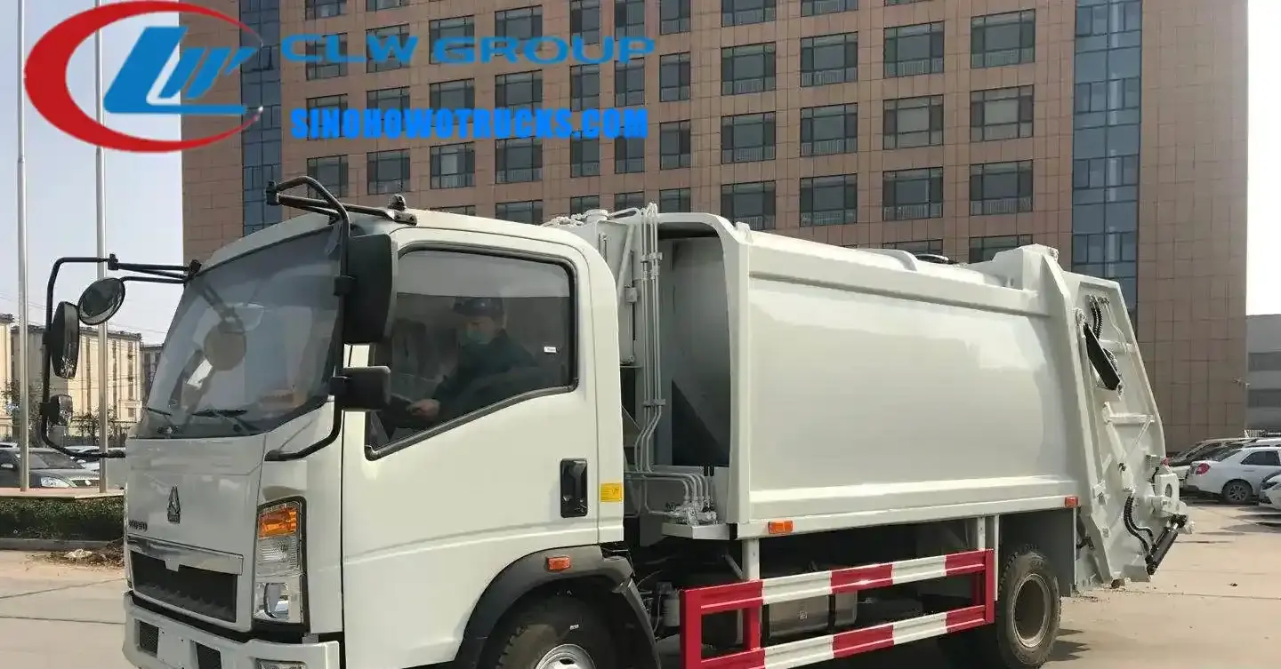 Sinotruk HOWO small garbage truck in urban waste collection with rear loading door open