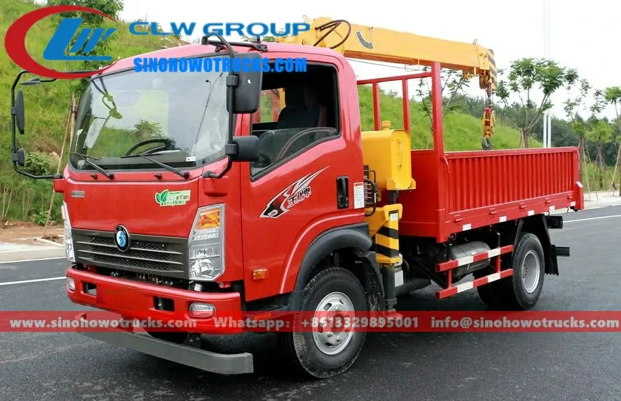 Sinotruk Wangpai mini tipper crane truck in service with crane extended and cargo box tipped
