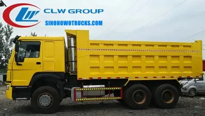 10 wheel Sinotruk HOWO 25cube tipper truck in action at a quarry site in Zambia with front lift hydraulic system raised
