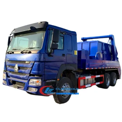 Side view of the skip bin loader with the hopper in the lowered position and bin in place