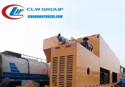 10 wheeler Sinotruk HOWO slurry seal truck in operation with asphalt and aggregate being sprayed on a road surface