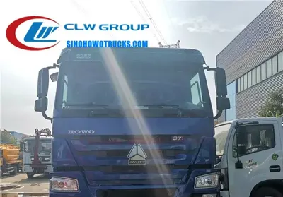Side view of the 12 wheeler HOWO compactor truck showing high-strength steel compaction body and hydraulic lift mechanism