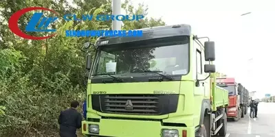 Side view of the HOWO crane truck showing the cargo body and crane installation space
