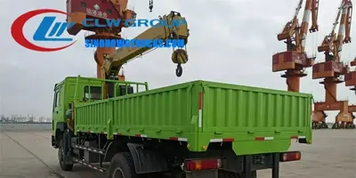 Rear view of the HOWO crane truck with the crane boom extended and hydraulic lines visible
