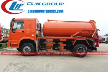 4×4 Sinotruk HOWO 10000L sewage vacuum tanker in service in Cameroon with front-mounted vacuum pump and control panel