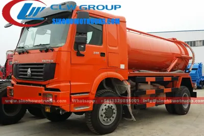 Side view of the HOWO sewage tanker showing the 11.00R20 tires and 4×4 chassis with high ground clearance