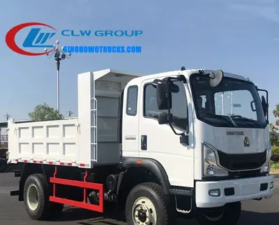 Side view of the HOWO 4x4 mining tipper truck showing the 3TG-E110*450 hydraulic cylinder and side door