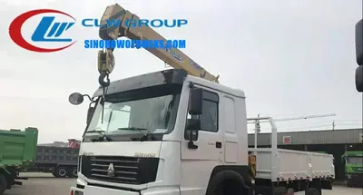 Rear view of the 4×4 HOWO crane truck showing the cargo box and crane mounting
