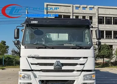 Side view of the HOWO dump truck showing hydraulic piston and high strength steel body