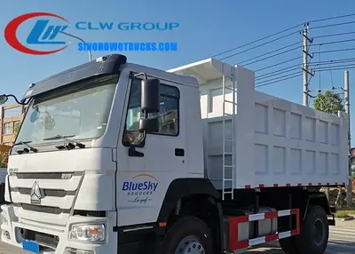 Rear view of the dump truck with side lifting mechanism in open position